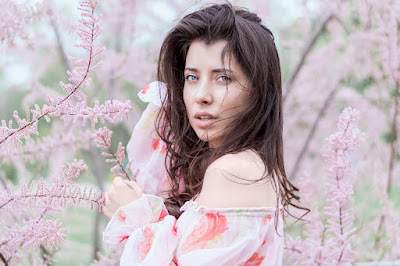 model wearing white photo taken in a garden