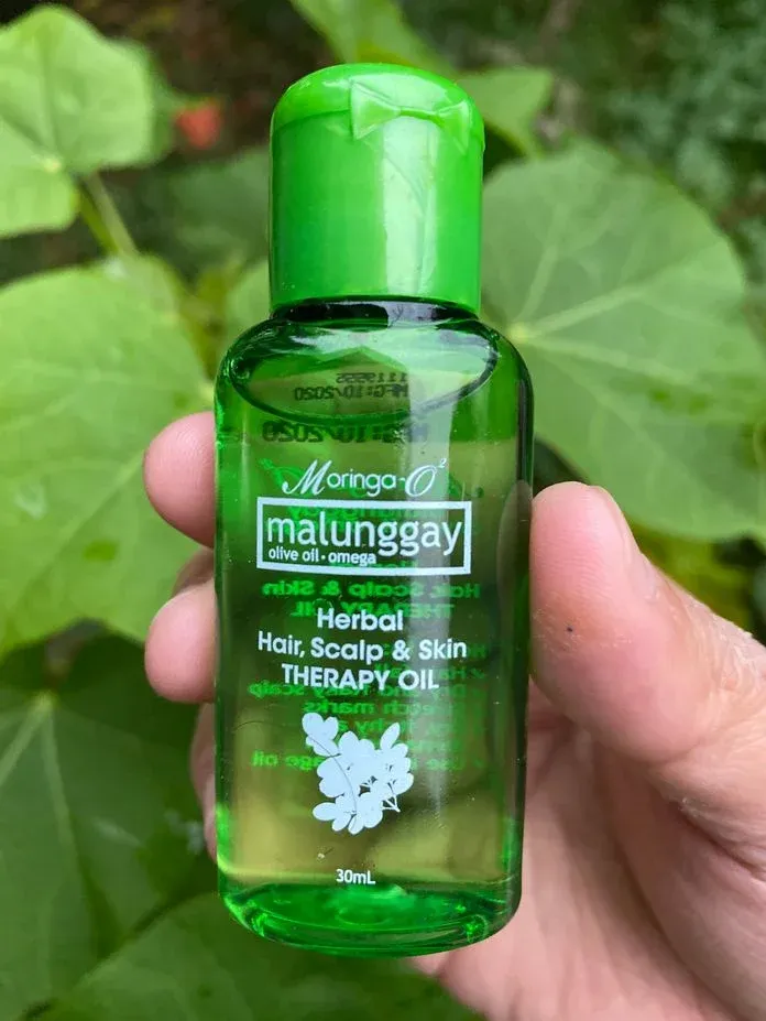 A bottle of Moringa-O2 Herbal Therapy Oil
