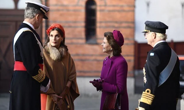 Crown Princess Victoria, Princess Sofia, Queen Silvia. Queen Letizia wore a headband by Cherubina. Carolina Herrera bag. cape