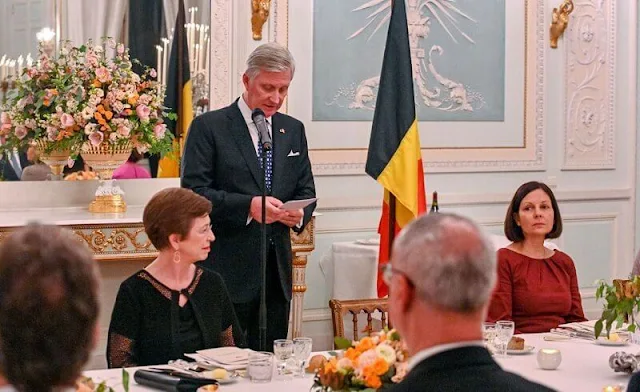 Queen Mathilde wore floral print long sleeve silk dress by Dries van Noten. President Alexander Van der Bellen and Doris Schmidauer