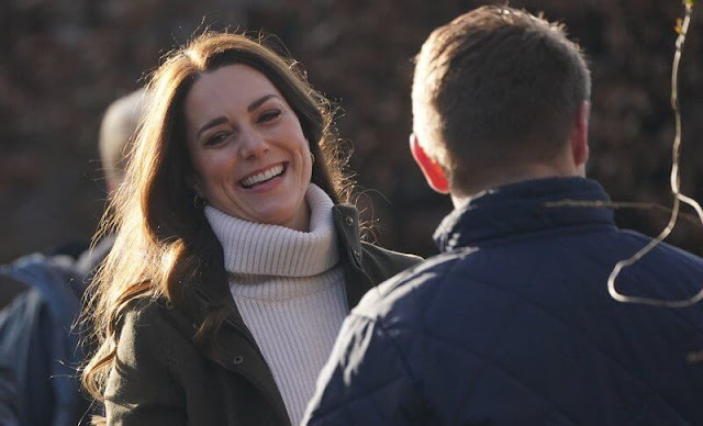 Kate Middleton wore a khaki jacket from Seeland. Mother-of-pearl drop huggie hoop earrings from Maria Black