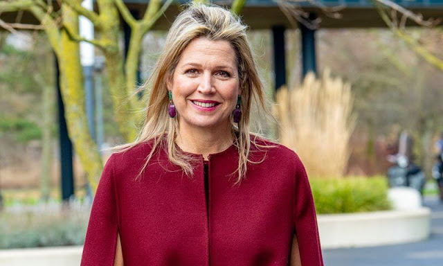 Queen Maxima wore a wool and cashmere-blend cape by Valentino. Wandler Georgia wine shoulder bag. Gianvito Rossi Laura boots