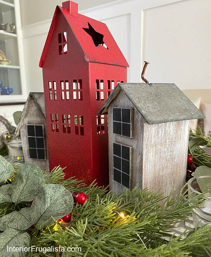 How to turn dollar store bird houses into adorable wood Scandi houses with DIY galvanized roofs for an easy five minute Christmas table centerpiece.