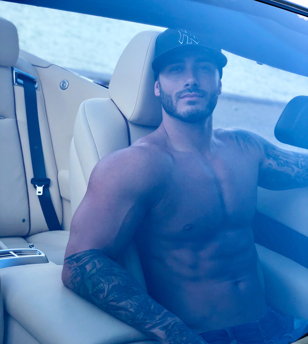 sexy-fit-strong-shirtless-muscular-man-tattoos-driving-car