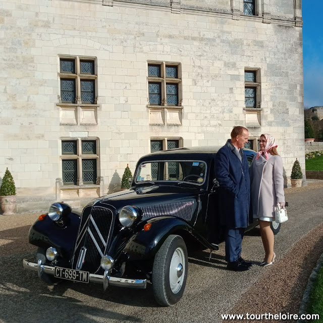 Honeymoon couple with Citroen Traction Avant at the Chateau Royal d'Amboise, Indre et Loire, France. Photo by Loire Valley Time Travel.
