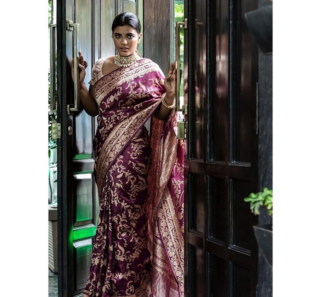 Beautiful actress Aishwarya Rajesh in purple banarsi saree