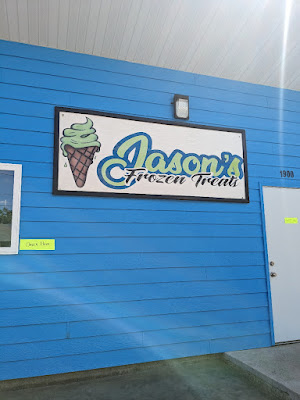 front of Jason's Frozen Treats in Sioux City including a large sign with the logo