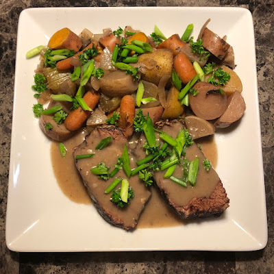 Bison Yankee pot roast, with potatoes, sweet potatoes, carrots and turnips topped with a bit of scallion and fresh parsley