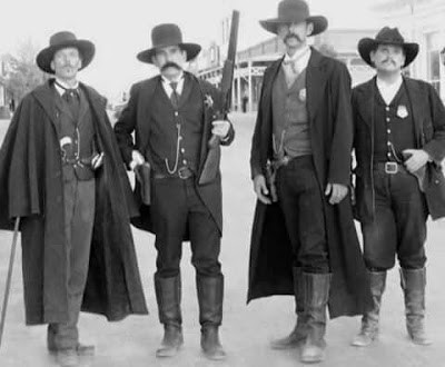 Pictured left Doc Holliday with Wyatt Earp and his brothers.