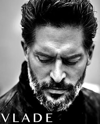 Black and White photo of Joe Manganiello in a goatee and leather jacket looking down the caption reads Vlade