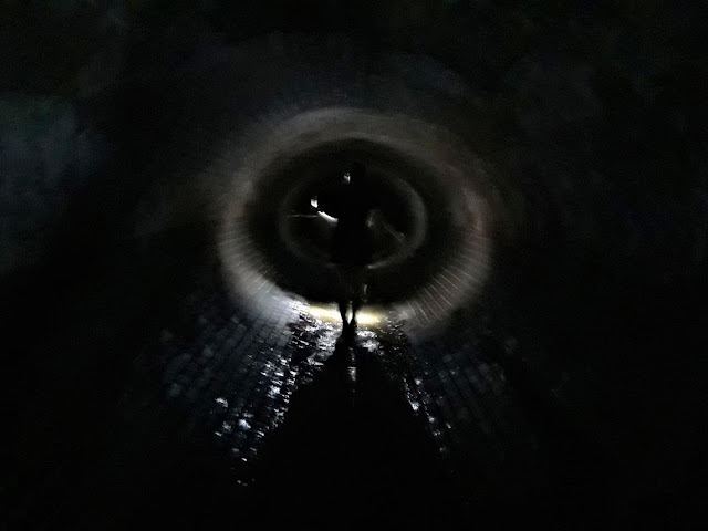 Silhouette in underground tunnel