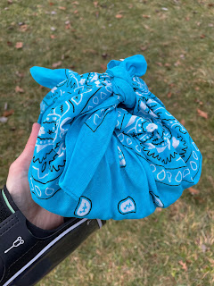 A bandana holding the race swag.