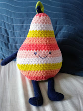 smiling striped pear-shaped stuffed toy