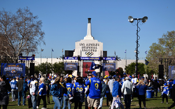 The Coliseum Peristyle towers in the background as Rams fans gather for the Super Bowl LVI championship parade and rally...on February 16, 2022.