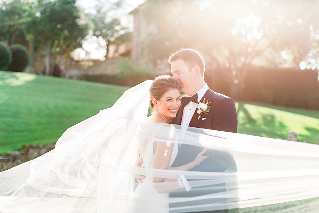 bride smiling with long veil