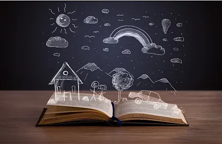 Open books with drawing of clouds and sun hovering on top