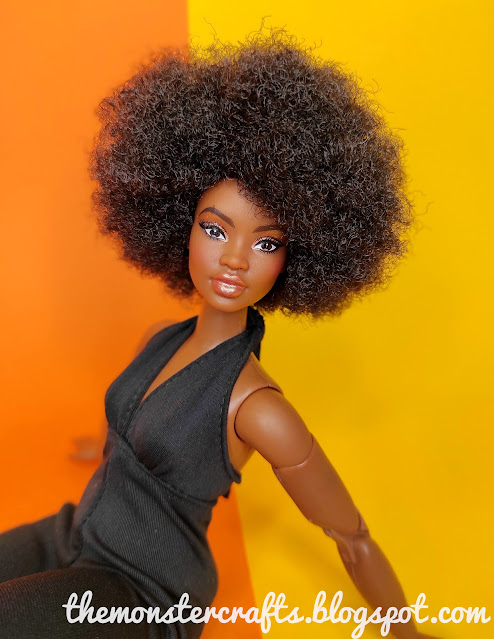 Barbie Looks 2 sitting on an orange and yellow backdrop