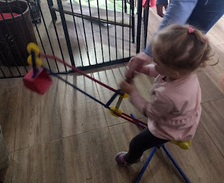 Rosie playing with her new digger