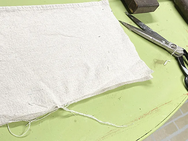 frayed drop cloth fabric and scissors