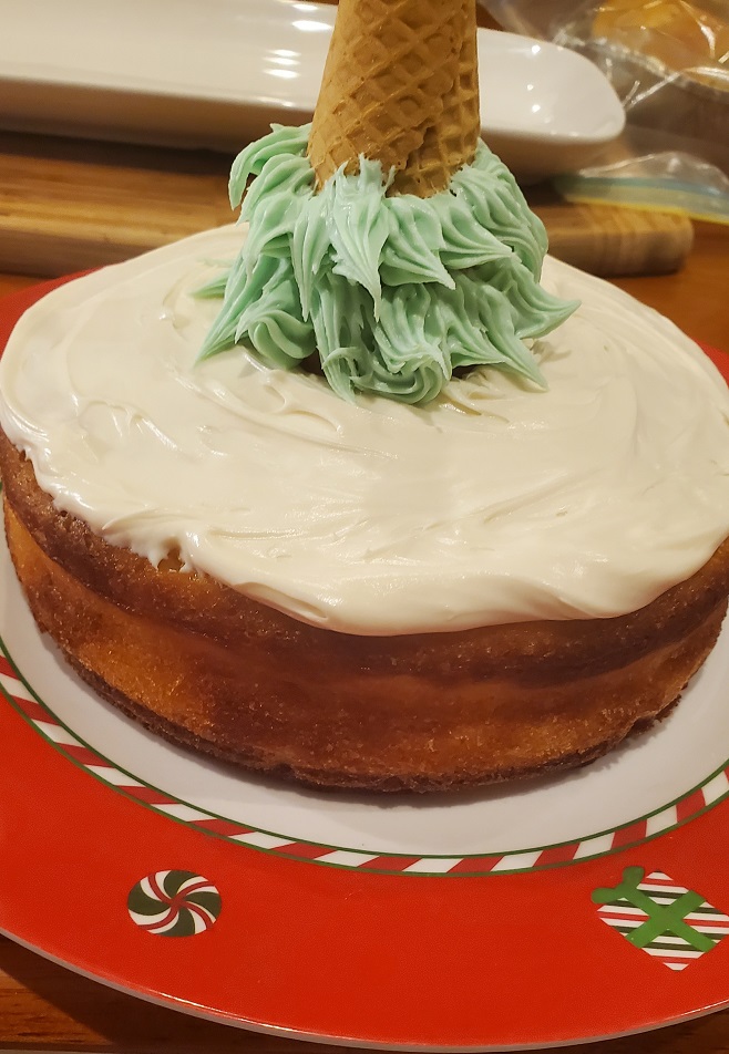 christmas trees made out of sugar cones with frosting on a cake