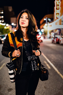 color photograph of Gabriela Campos with her cameras