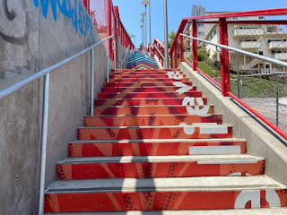a stairway going up with colorfully painted steps