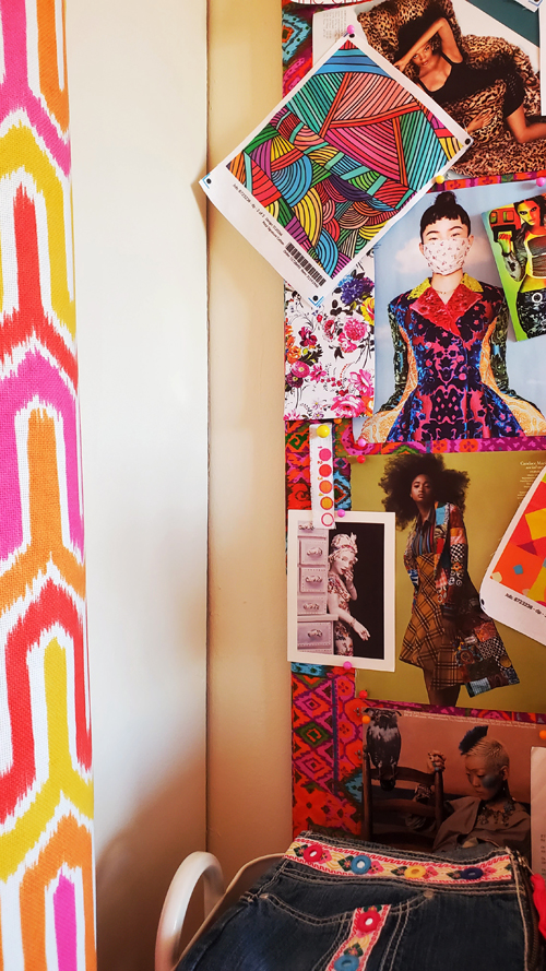 mood board with art, fashion magazine clippings, and fabric swatches