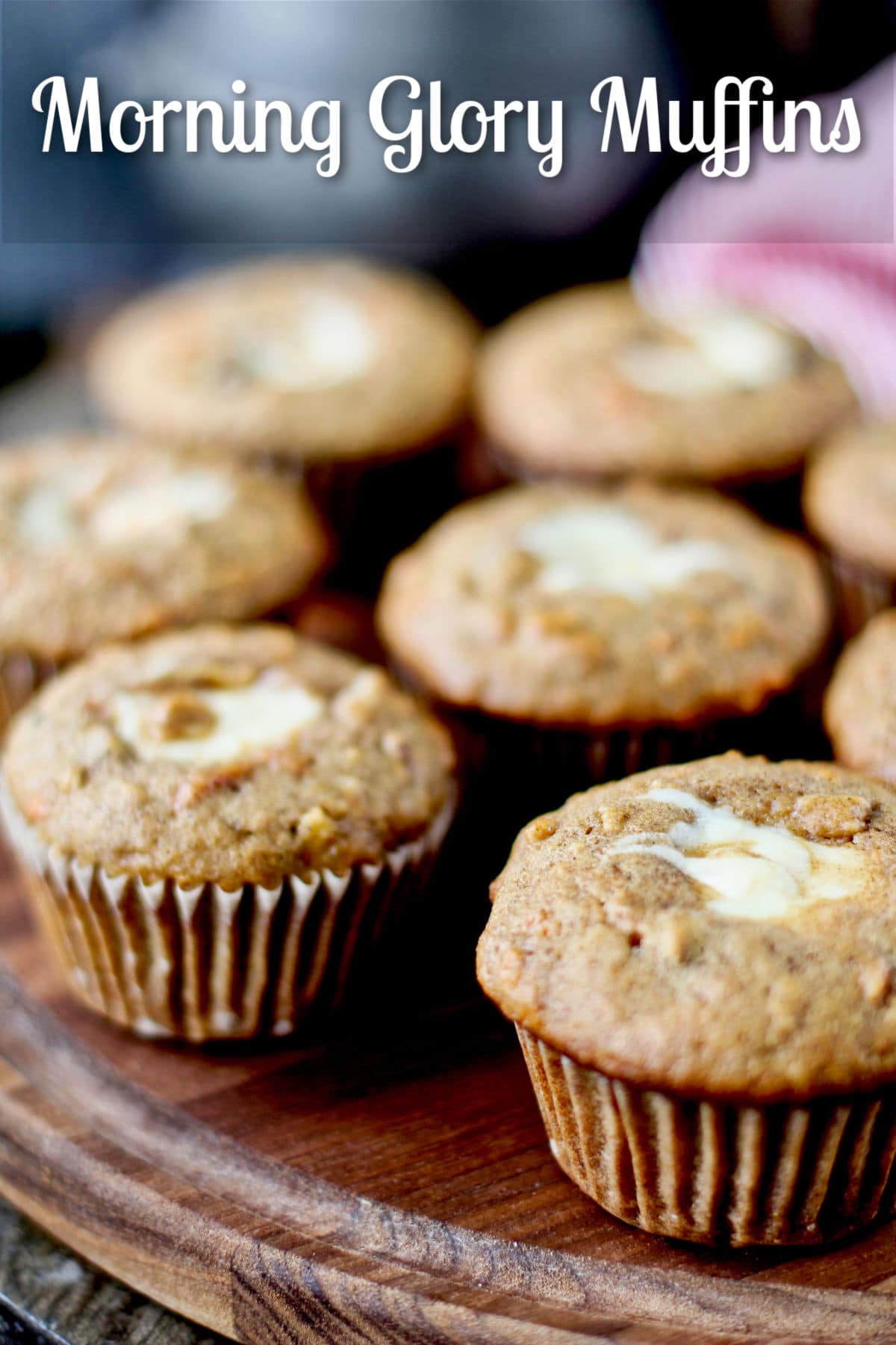 Morning Glory Muffins with Vanilla Cream Cheese Filling on a wooden board.