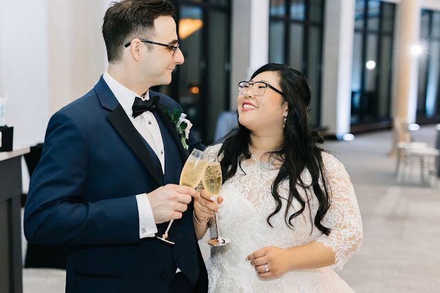 bride and groom cheers with champagne