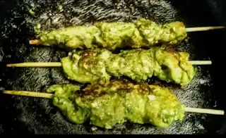 Cooked pahadi kabab sticks on a pan or tawa