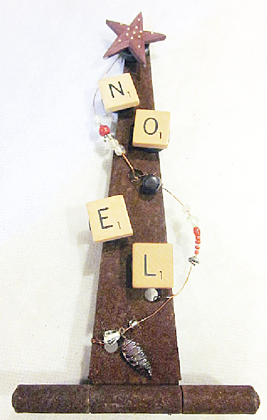 Scrabble letters on rusty hinge.