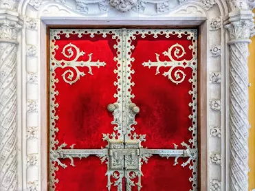 Lisbon Day Trip: Ornate red door at Quinta da Regaleira