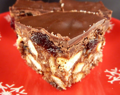 Christmas Tiffin: a no-bake bar cookie with brandy, candied cherries, and crushed tea biscuits, topped with chocolate.