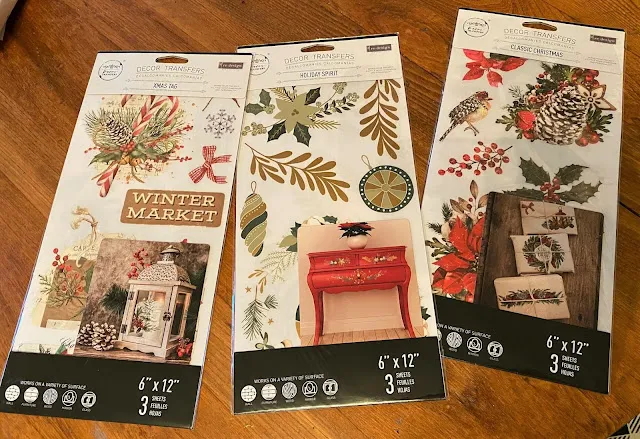 Photo of three packages of Christmas transfers from Redesign with Prima.