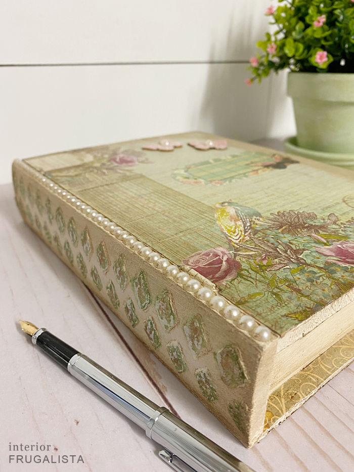 How to upcycle an unfinished wooden book box with pretty decoupage vintage-style scrapbook paper and dollar store supplies and give it an aged patina.