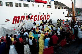 Rescued passengers waiting to board a ferry to take them to the mainland