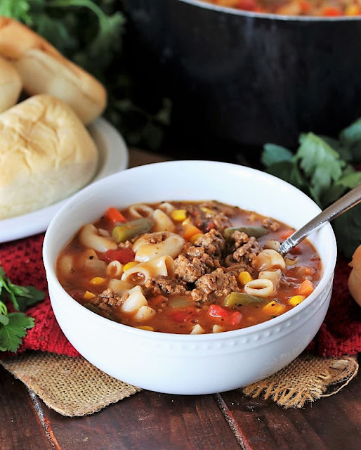 Serving of Cheeseburger Macaroni Soup with a Spoon Image