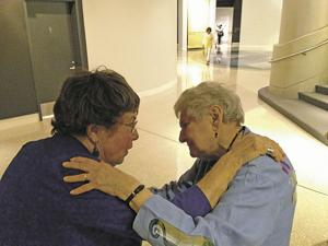 Sonia and Ida embrace at the Norton Museum of Art in Florida during a Photo League exhibit in 2013