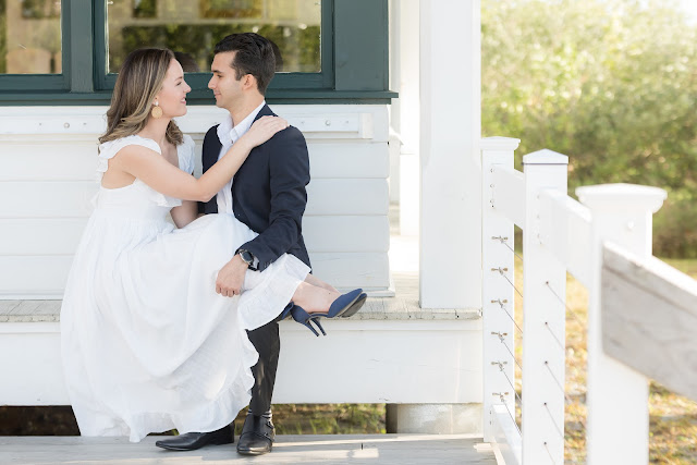 couple sitting on bench smiling