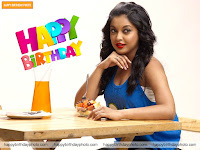 sitting with lemon juice glass and jug, smiling b'day wish pc background