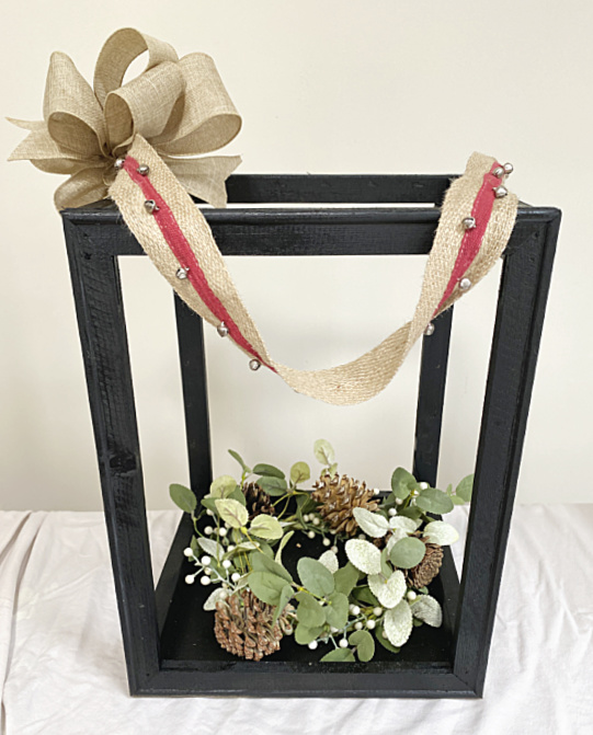 candle lantern with wreath and ribbon