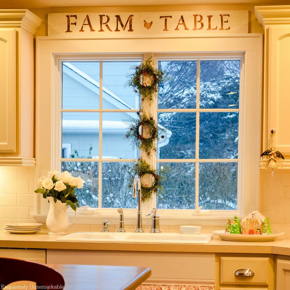 Farm To Table Wooden sign mounted over kitchen sink for Christmas