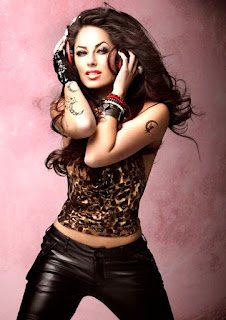 super hot picture, skin fit black jeans, leopard cloth top, tattooed arm and wrist