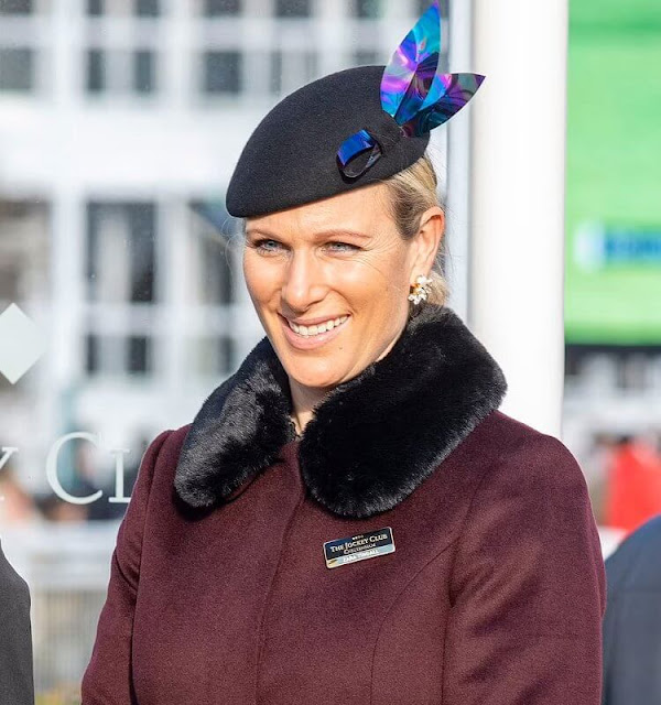 Zara Tindall wore a faux-fur collar wine red wool coat from Hobbs. Caroline Svedbom Electra pearl crystal gold earrings