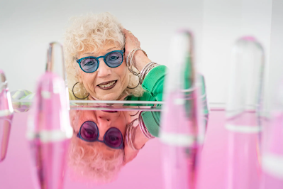 The artist Judy Chicago is relected on a table in her studio in Belen, N.M.,