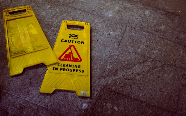 A safety sign saying cleaning in progress.
