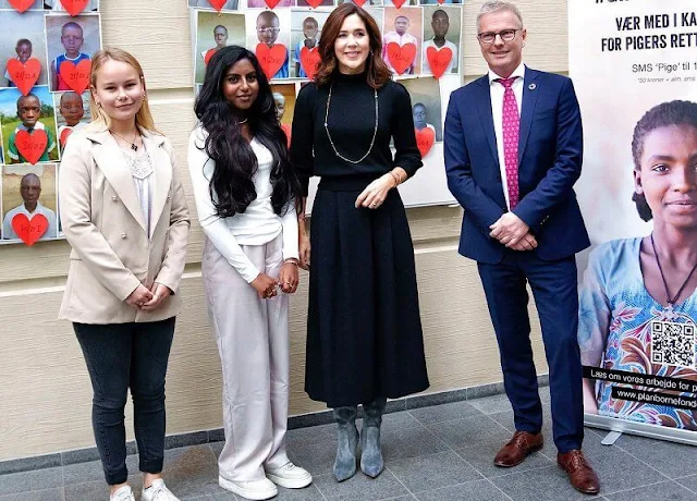 Crown Princess Mary wore a wool sweater by Co. Dulong delphis earrings and esme bracelet. Rebekka Notkin bracelet