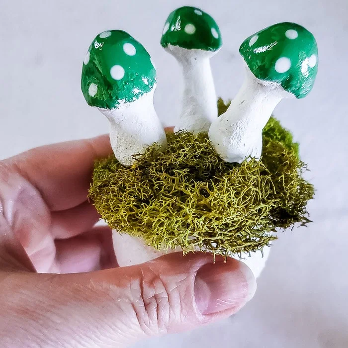 green painted mushrooms with styrofoam and moss