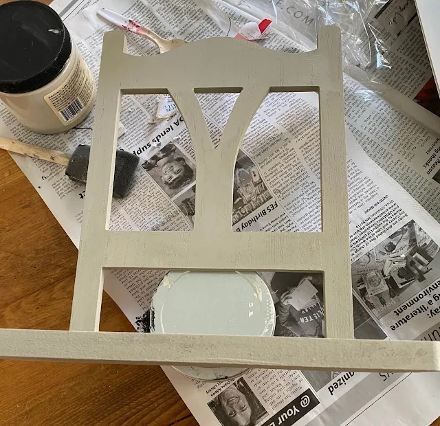 Photo of Target Bullseye Playground chair shelf being painted in dried sage.