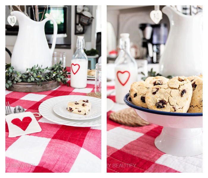 Valentines breakfast table with heart scones, heart pouches for silverware, greenery, ironstone pitcher